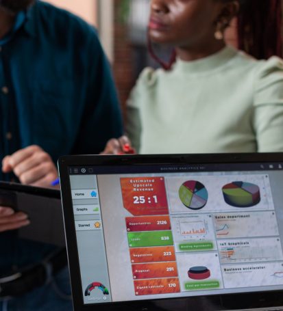 Small business employee CRM beginner uses customer relations software to do her job.