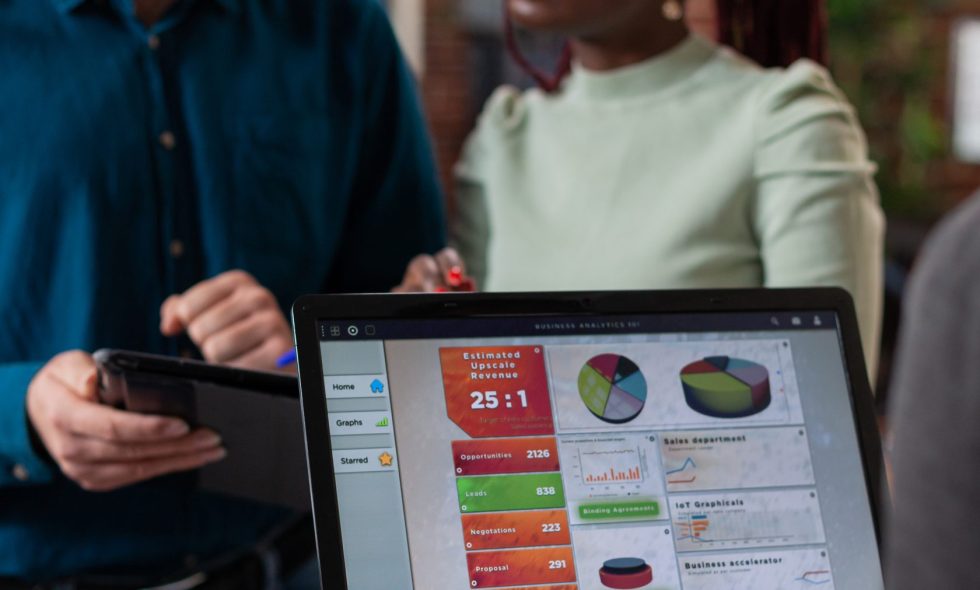 Small business employee CRM beginner uses customer relations software to do her job.