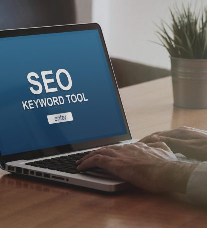 Small business owner uses SEO keyword tool to amplify their business website through selecting the best & highest quality words.