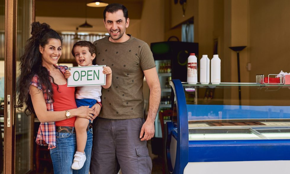 Small business owners stand in front of new opening store powered by A Marketing Space.